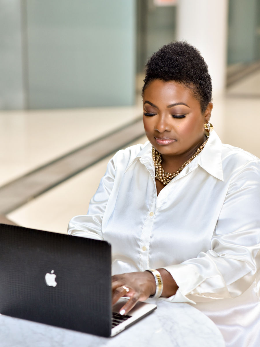 Dr. Deloris Benjamin seated