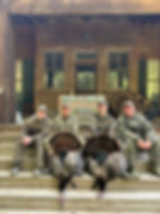 Hunters with turkeys at a deer hunting outfitter in SC