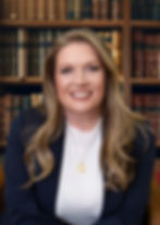 Portrait of Sharlene Gilmer Anderson, showcasing her warm smile and confident demeanor against a neutral background.