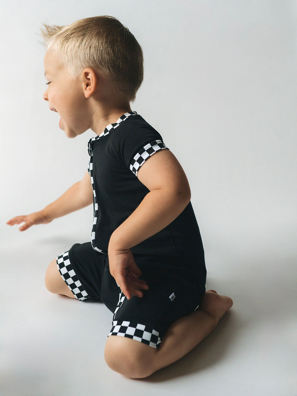 Thumbnail: Racing Checkers Shortie Zip Romper