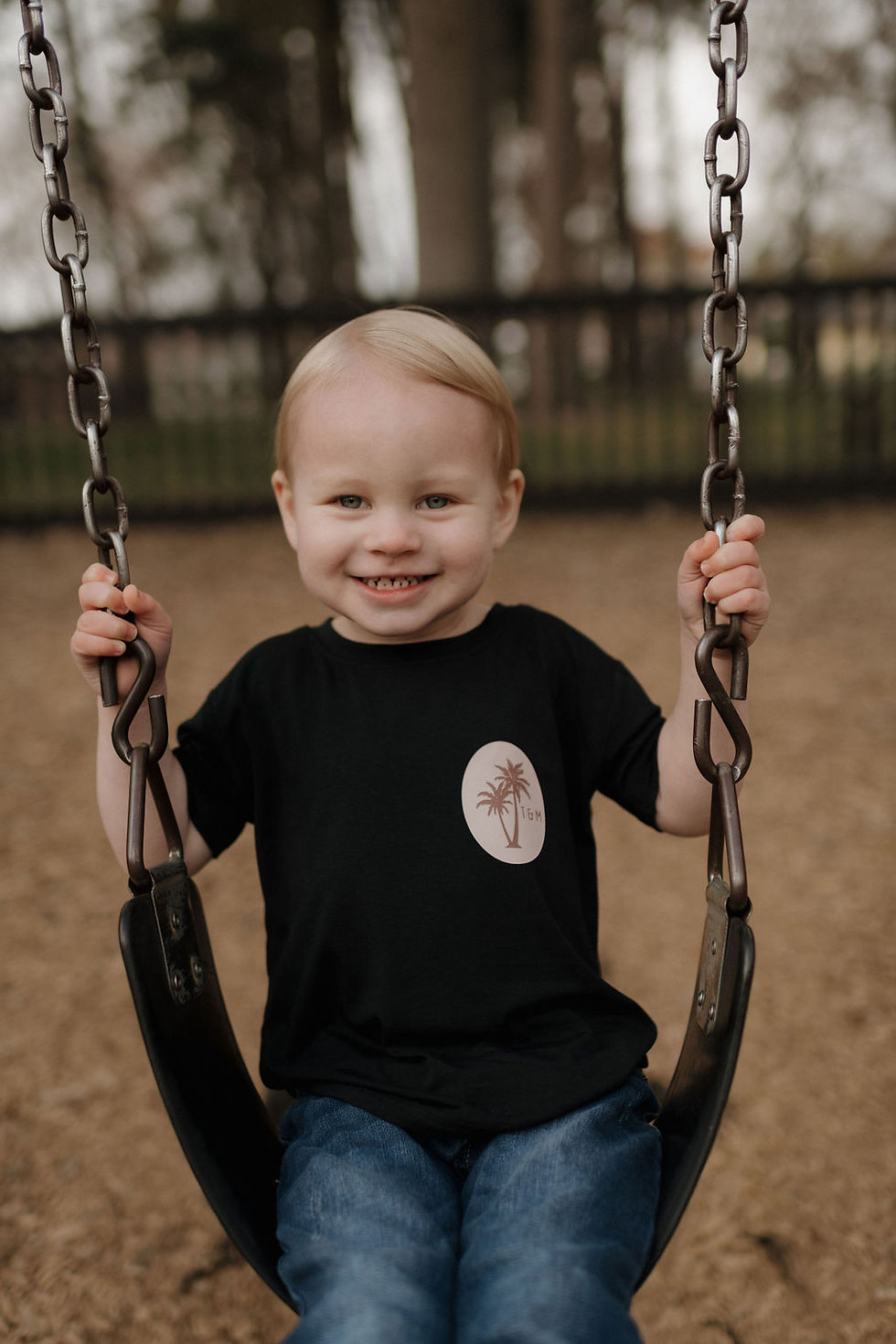 Thumbnail: Front of Timber Bamboo Surf Shirt worn on boy on swing