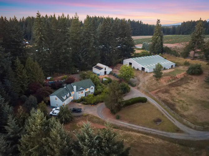 High-end ranch estate photography Oregon aerial barn and pasture view