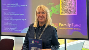 Craighalbert CEO Heather Gray holding a copy of the Centre’s research report, Provision in Scotland of Early Learning and Childcare for Children with Profound and Multiple Learning Disabilities with Life Limiting or Life Threatening Conditions.