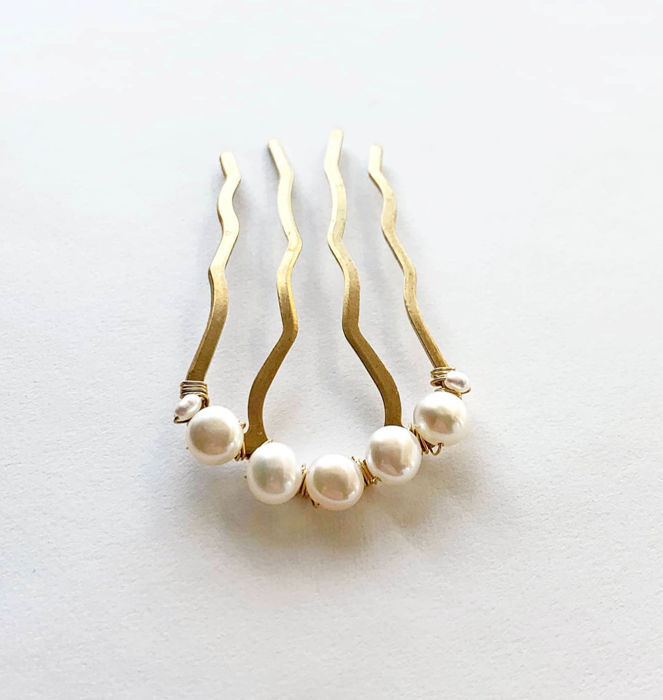 Pearl Wedding Comb that has five freshwater pearls hand wrapped around the comb.