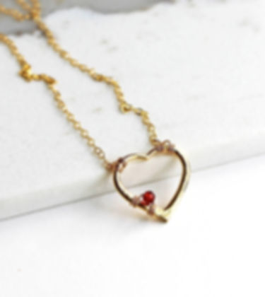 Gold Heart Necklace with a Garnet
