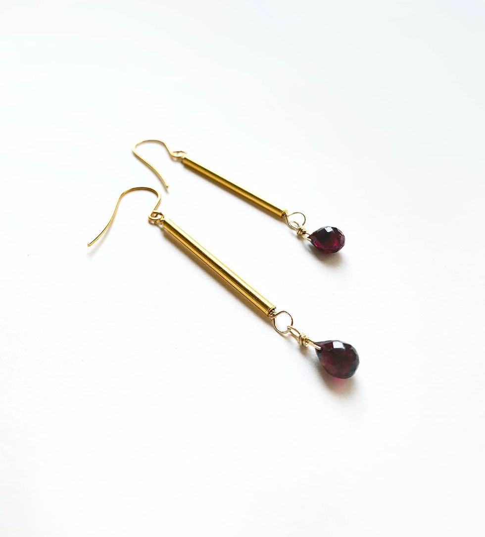Gold bar drop earring with garnet
