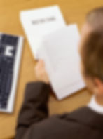 A man looking over a resume