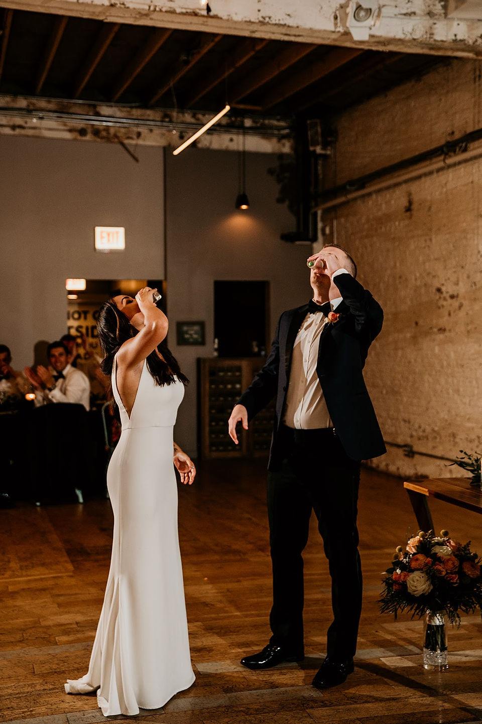 Bride and groom taking shots