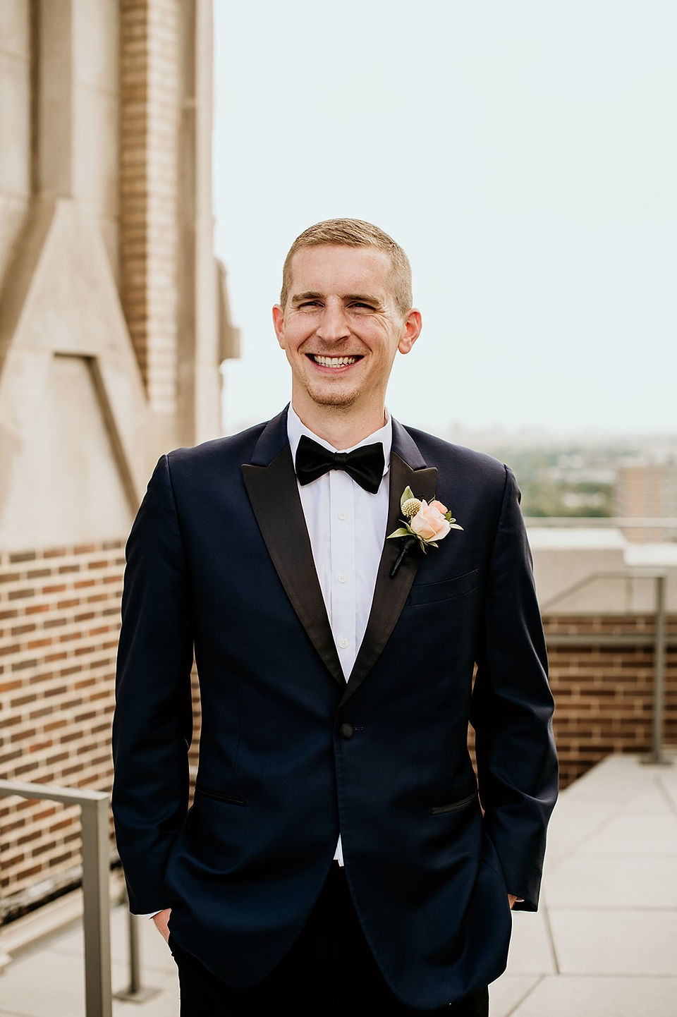 Groom on the rooftop of The Robey
