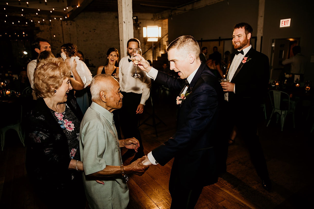 Groom dancing to wedding DJ