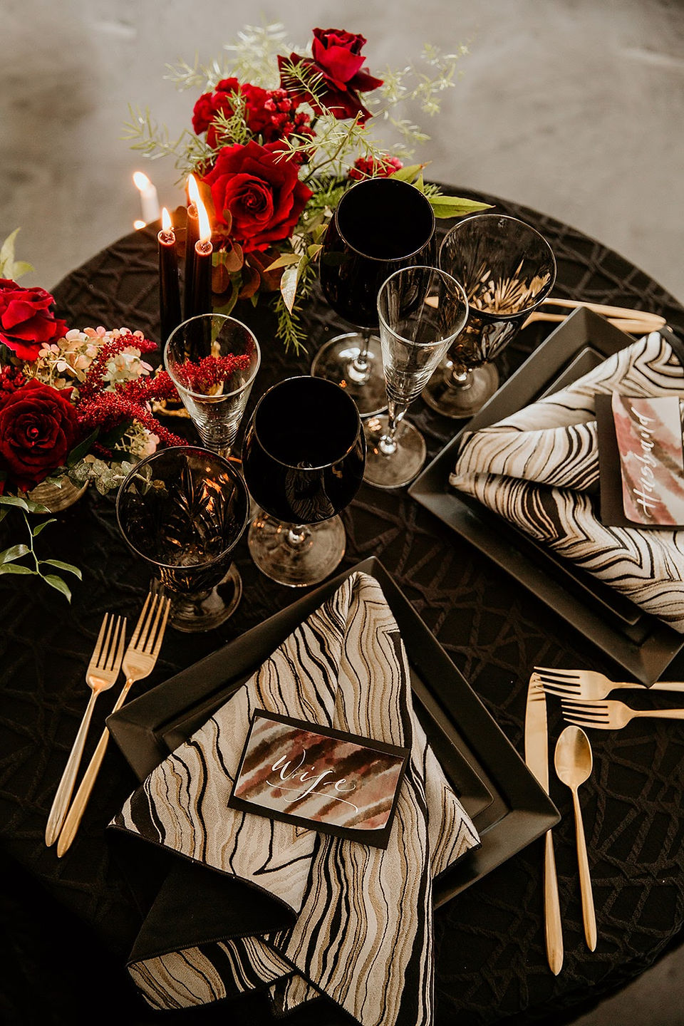 Edgy black and burgundy wedding tablescape