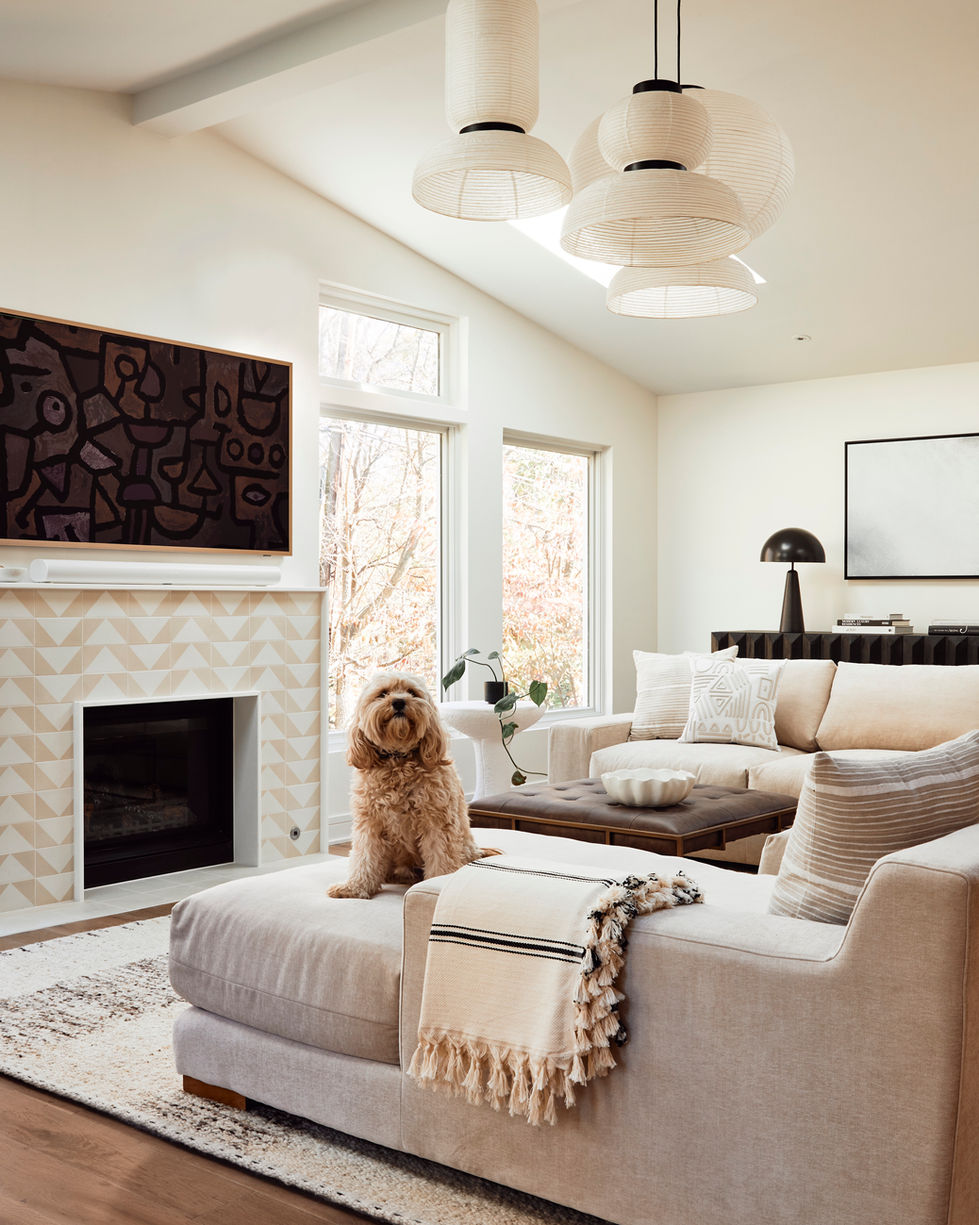 Our Wynnewood Project living room with a fireplace surround in Zia Tile Press Play and Formakami lantern pendants.