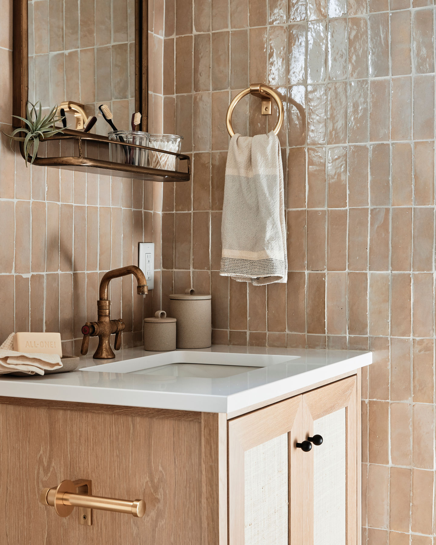 Our Jersey Shore Project bathroom with a custom white oak and seagrass vanity. The walls are Zia Tile Glazed Earth zellige.