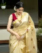 Maroon Floral Embroidered Tissue Kuthampully Kasavu Saree image close up view