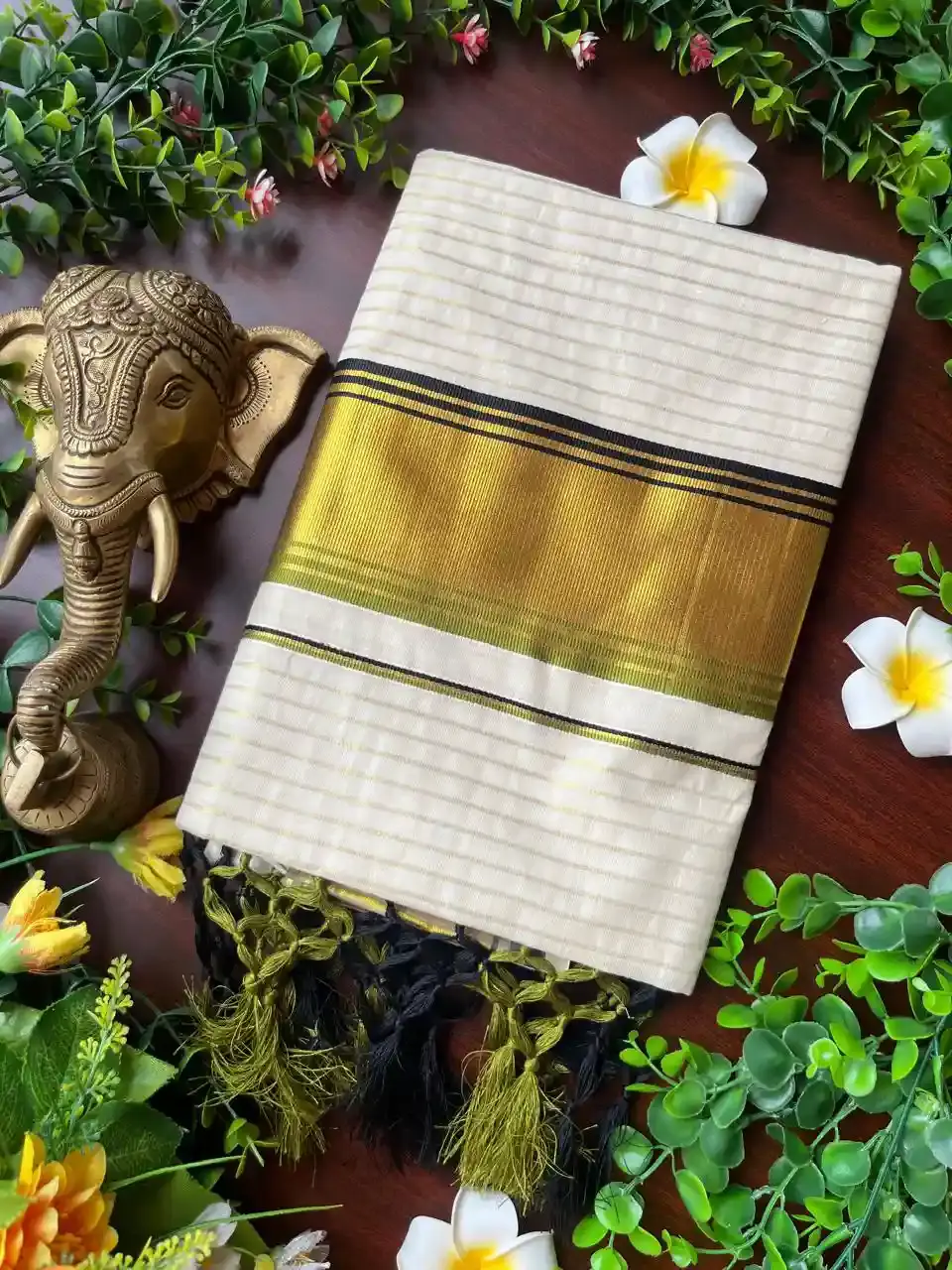 Sage Green Black Stripe Tussel Cotton Kerala Kasavu Saree image folded view