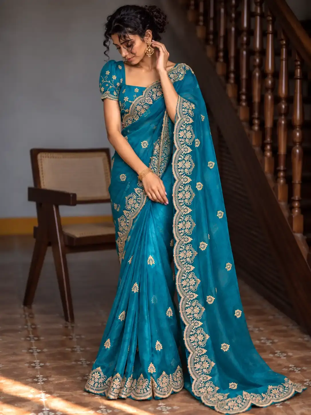 Rich Teal Blue Designer Silk Saree with Ornate Gold Embroidered Border image main view