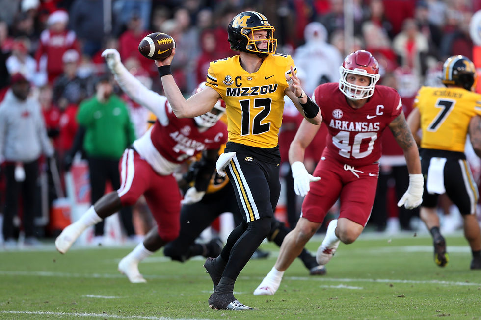 Brady Cook throwing a pass against Arkansas