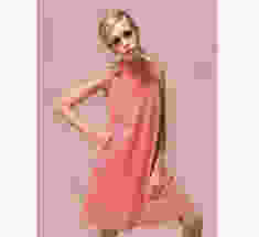 Picture of a young Twiggy, when she was modelling, and very thin, wearing a shift.