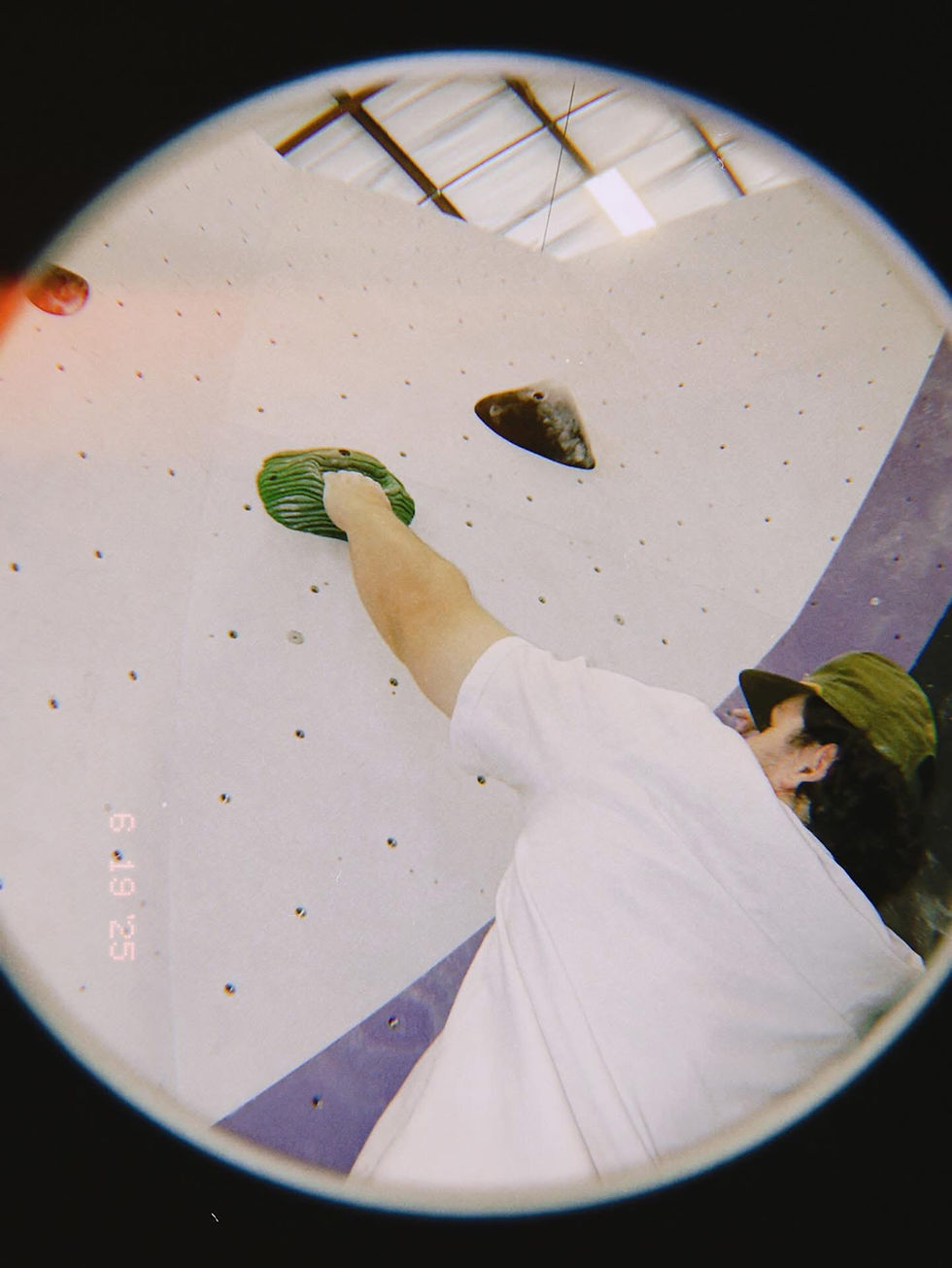 man grabbing hold man grabbing hold in climbing gym