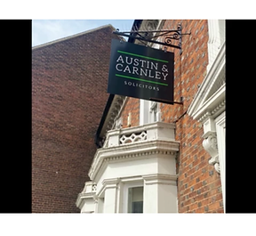 Austin & Carnley sign.png