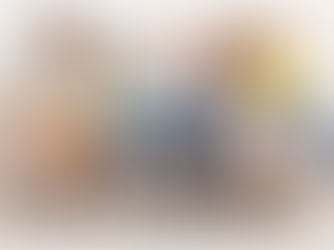 A group of women sat on a sofa smiling