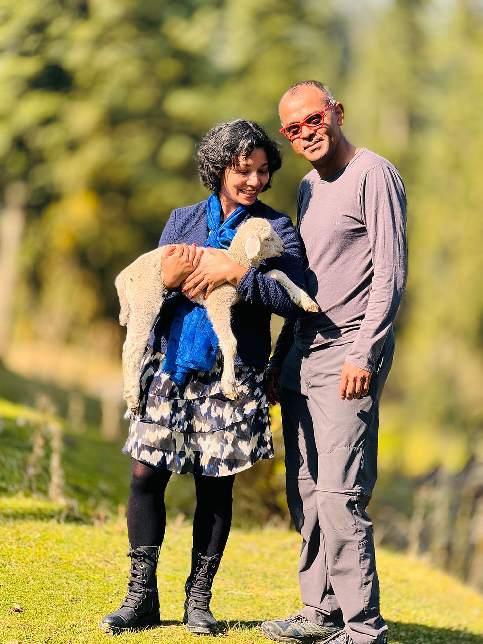 A joyful moment in the countryside with Sarmin and Bahar, basking in the sunshine while cuddling a gentle lamb amidst lush greenery.