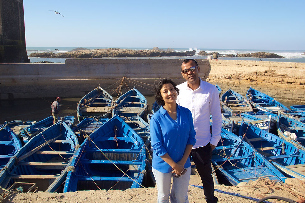 A serene day by the sea in Essaouira, where vibrant blue boats float gently, and the ocean whispers its timeless tales.
