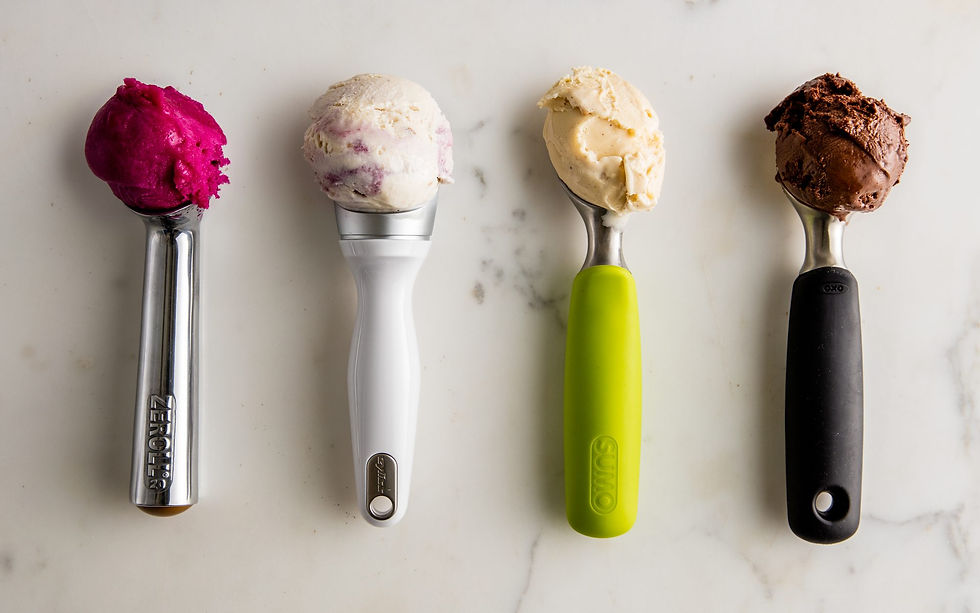 Four different ice cream scoops, each with a different kind of ice cream scooped in each one