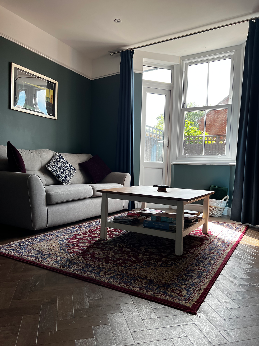 Wide angle view of cosy living room in a Shrewsbury rental with warm lighting