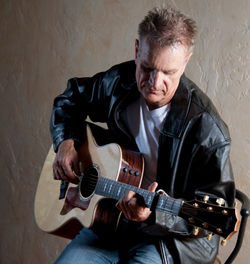 Michael John Krynak with guitar