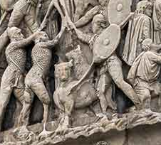 A close up section of Marcus Aurelius Column In Rome depicting dogs participating in war