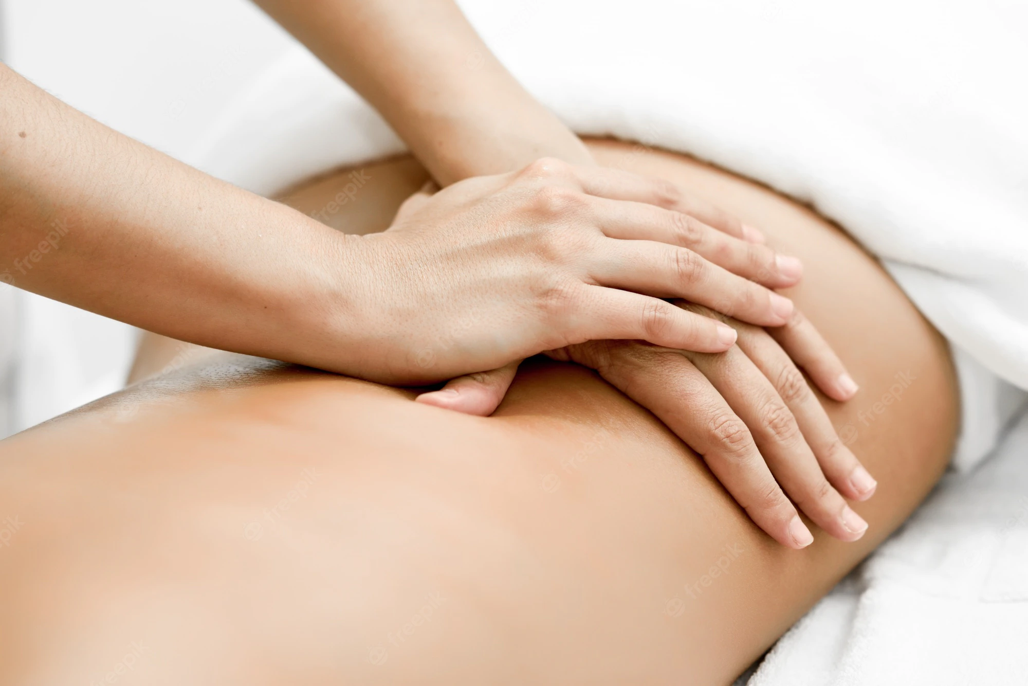 young-woman-receiving-back-massage-spa-center_1139-1142.webp