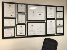 Office wall with certifications.