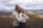 Romantic portrait of couple embracing on mountain