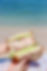 Best wheat bread sandwich with lots of veggies and meats in front of Waikiki Beach