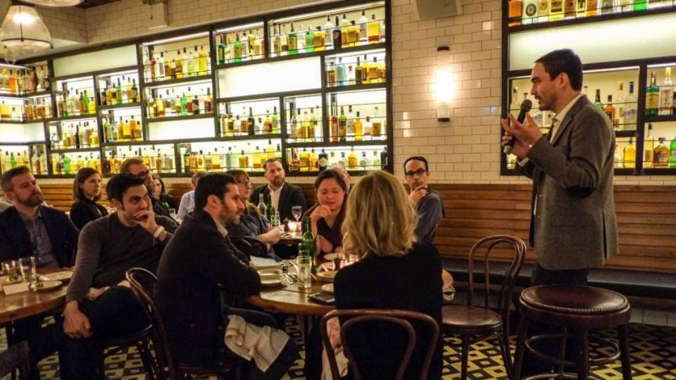 Advertising professionals talking at a restaurant