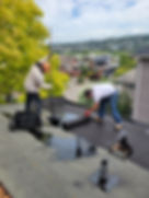 Two men installing a built up room system