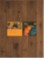 the "Tata's Earrings" picture book is set flat and opened on a wooden surface. You can see both the front and back cover. 