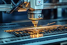 vecteezy_automated-industrial-laser-cutting-metal-sheet-with-sparks_57502234.jpg