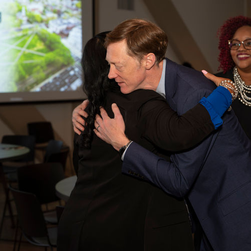 Mayor Elicker hugging an attendee