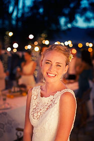 Bride with wedding guests in the background