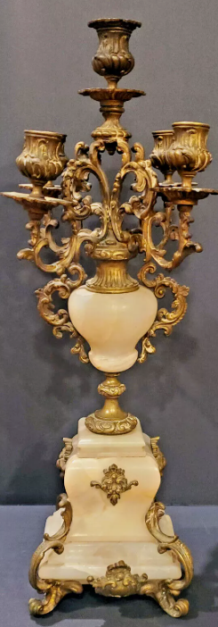 Ornate antique candelabra with three candle holders