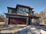 Ranch garage door panel in rosewood with standard glass