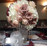 Stunning wedding centerpieces featuring silk florals and crystal beading