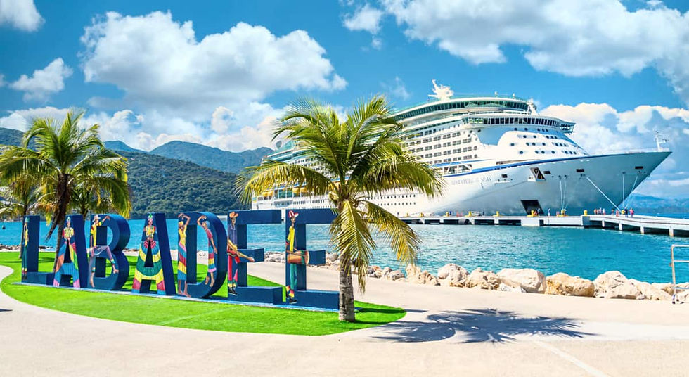 Royal Caribbean cruise ship docked at Labadee, Haiti with colorful Labadee sign, palm trees, and turquoise Caribbean water.