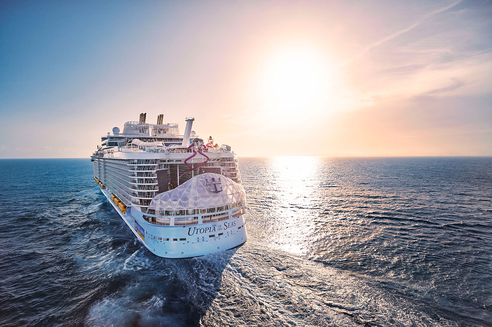 A Royal Caribbean cruise ship, Utopia of the Seas, sails into a glowing sunset over calm ocean waters. The ship leaves a gentle wake behind as it moves forward, with pastel pink and orange skies reflecting on the water. The view captures a peaceful, dreamlike moment at sea, symbolizing freedom, escape, and serenity.