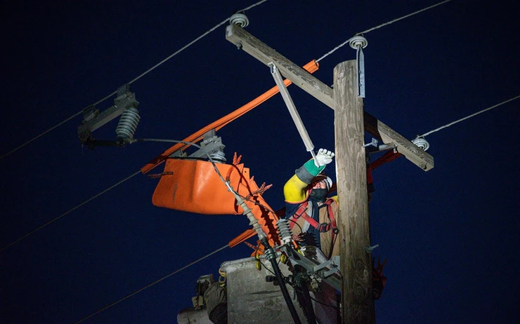 Lineman working a night job