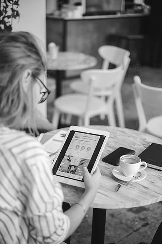 woman holding white iPad_edited.jpg