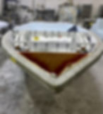 Much simpler to pull wiring and related system components when the cap has yet to be installed, as in this Hell's Bay skiff while under construction.