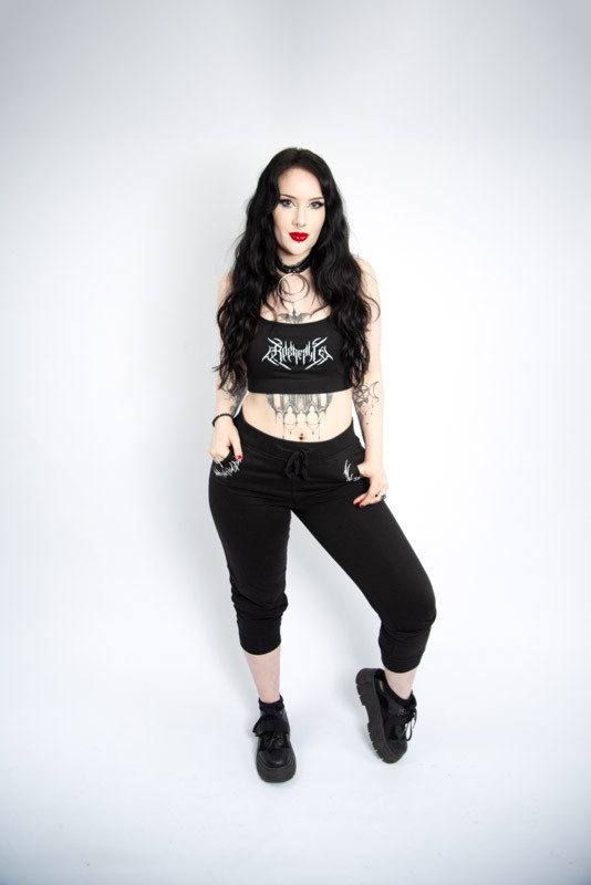 Gothic alternative jogging bottoms with white print on pockets and back.